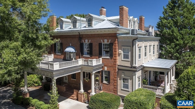 view of front of home with a balcony