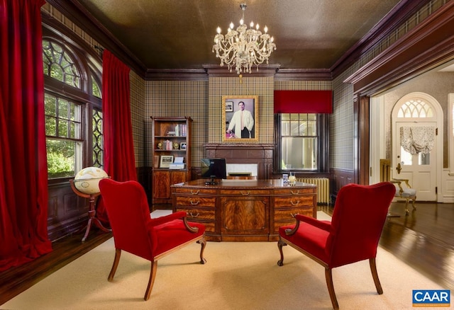 home office with an inviting chandelier, radiator, hardwood / wood-style floors, and crown molding