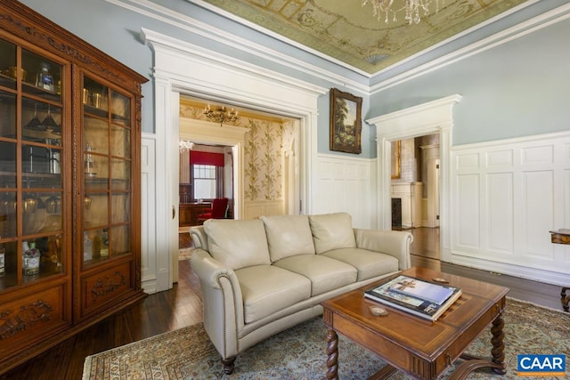 living room with ornamental molding and dark hardwood / wood-style floors