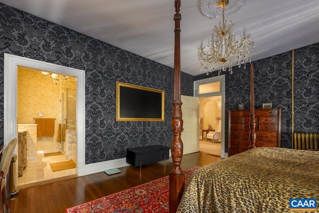 bedroom featuring radiator, dark hardwood / wood-style flooring, and a notable chandelier