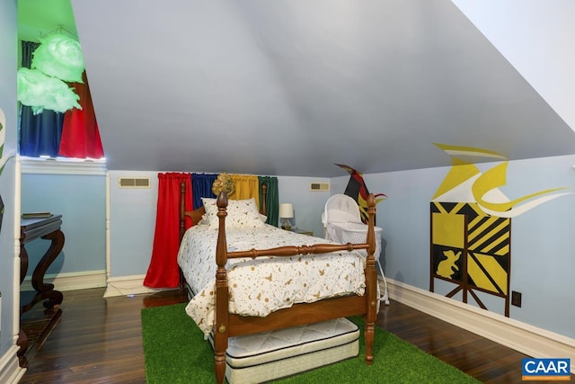 bedroom with lofted ceiling and dark hardwood / wood-style flooring