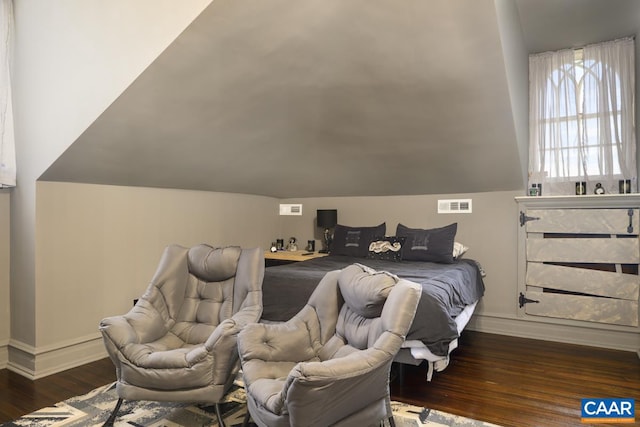 bedroom featuring lofted ceiling and dark wood-type flooring