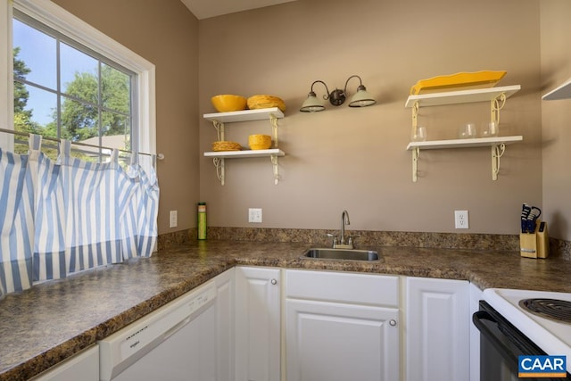 kitchen featuring white cabinets, sink, and white appliances