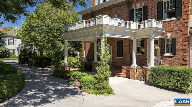 exterior space featuring a balcony