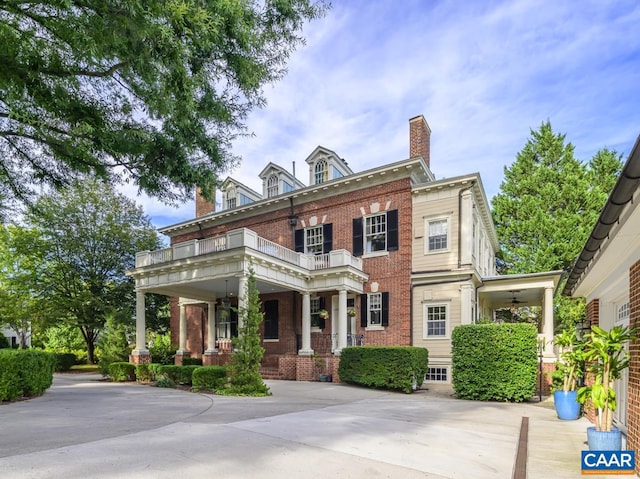 view of front of house featuring a balcony