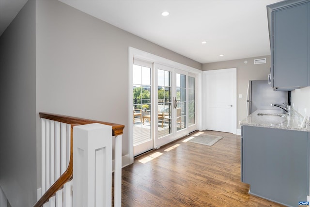 interior space with sink and dark hardwood / wood-style flooring