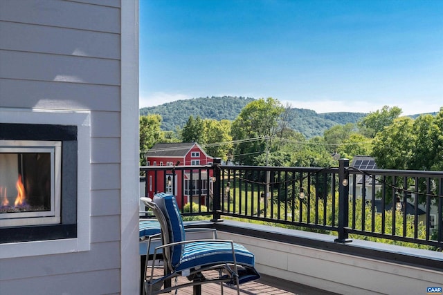 balcony featuring a mountain view