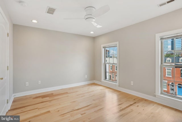 empty room with light hardwood / wood-style floors and ceiling fan