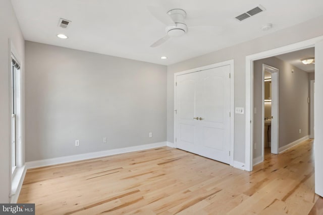 unfurnished bedroom with light hardwood / wood-style flooring and ceiling fan