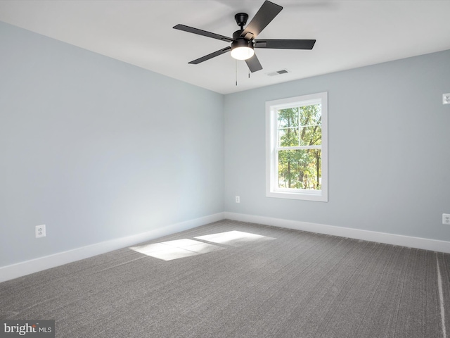 carpeted empty room featuring ceiling fan