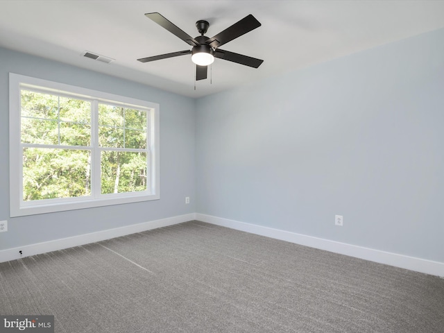 empty room featuring carpet and ceiling fan