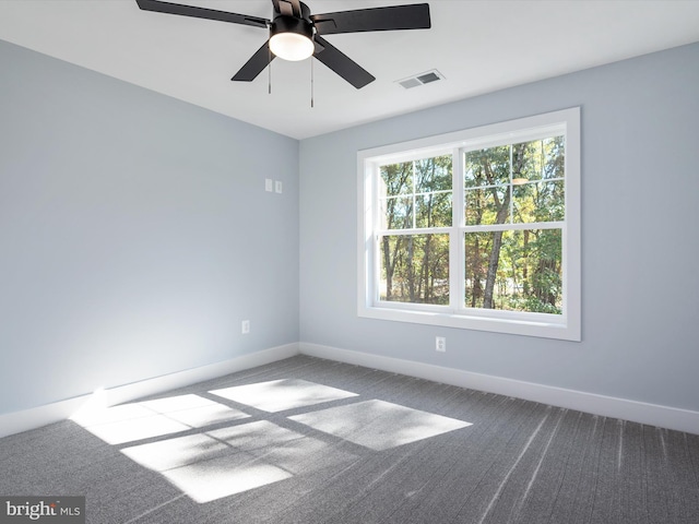 carpeted empty room featuring ceiling fan