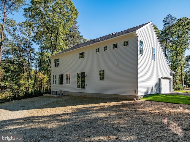 view of home's exterior with a garage