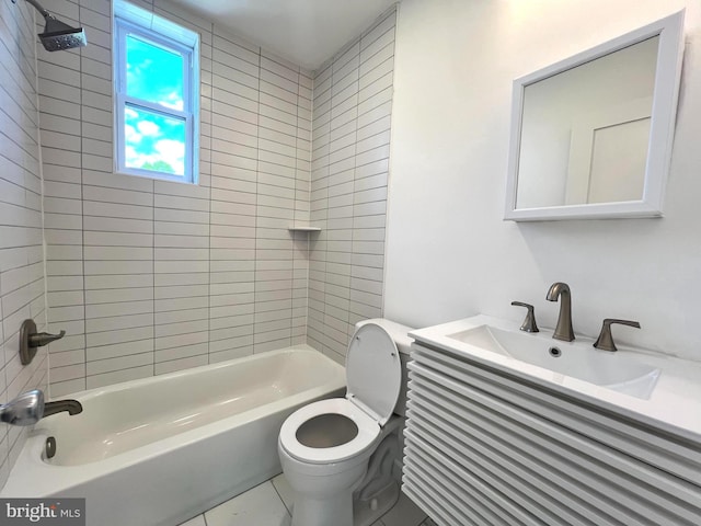 full bathroom with vanity, toilet, and tiled shower / bath