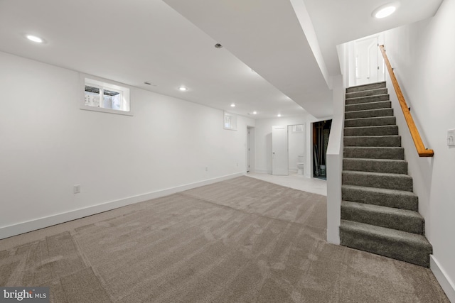 basement with light colored carpet