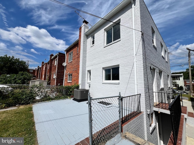 view of property exterior with cooling unit