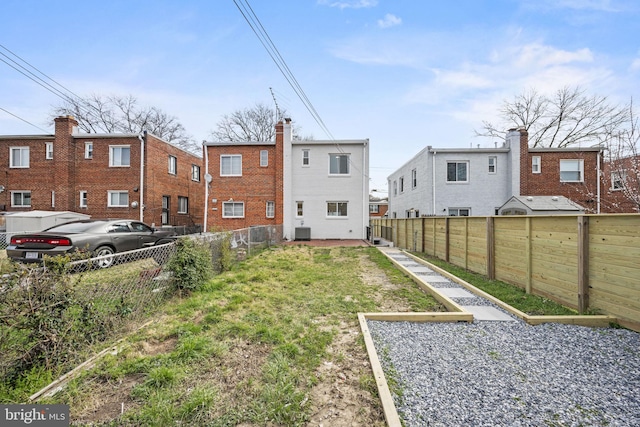 rear view of property with cooling unit