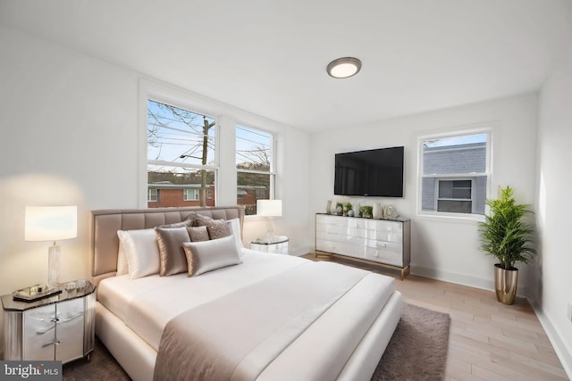 bedroom with hardwood / wood-style flooring