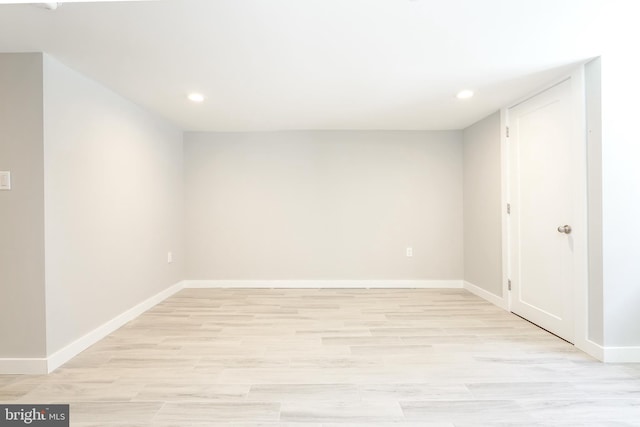 spare room with light hardwood / wood-style flooring