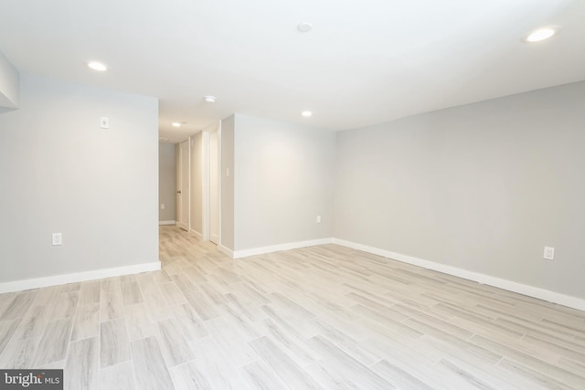 unfurnished room with light hardwood / wood-style flooring