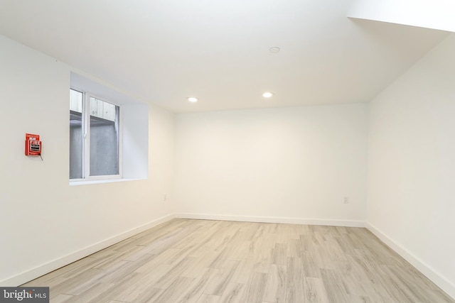 empty room with light hardwood / wood-style floors