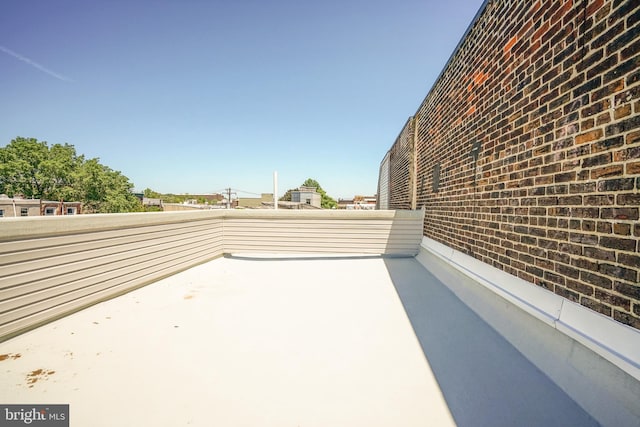 view of patio featuring a balcony