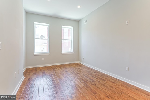 spare room featuring hardwood / wood-style flooring