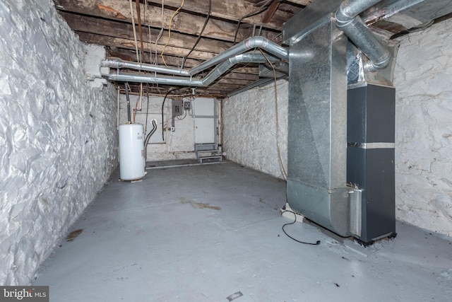 basement featuring water heater and heating unit