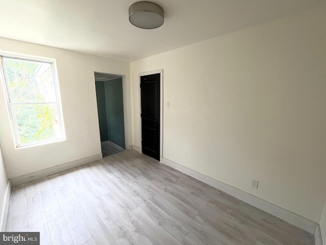 empty room with light wood-type flooring