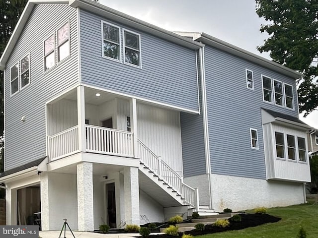 exterior space featuring a garage and a yard