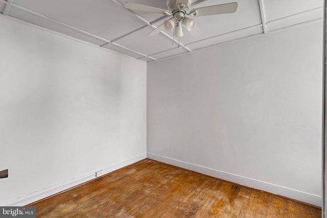 empty room featuring wood-type flooring and ceiling fan