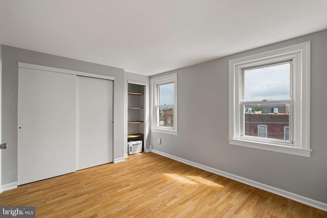 unfurnished bedroom with light hardwood / wood-style floors