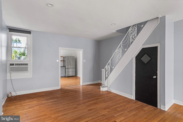 entryway featuring cooling unit and hardwood / wood-style flooring