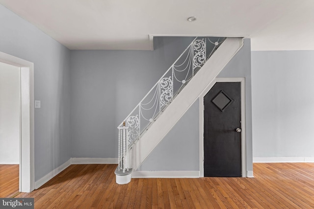 staircase featuring hardwood / wood-style flooring