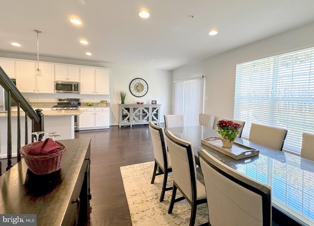 dining room with dark hardwood / wood-style flooring