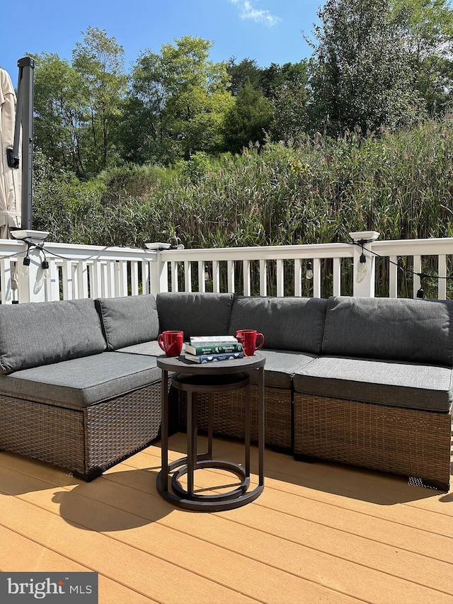 wooden terrace featuring an outdoor hangout area