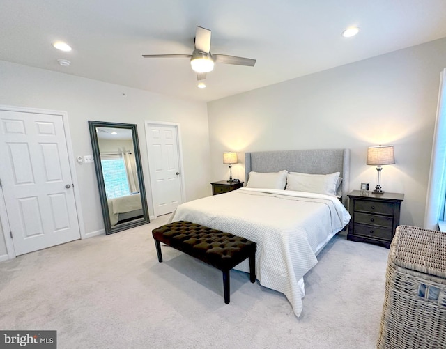 carpeted bedroom with ceiling fan