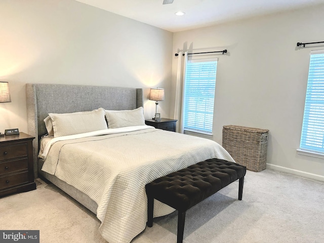 bedroom featuring light colored carpet