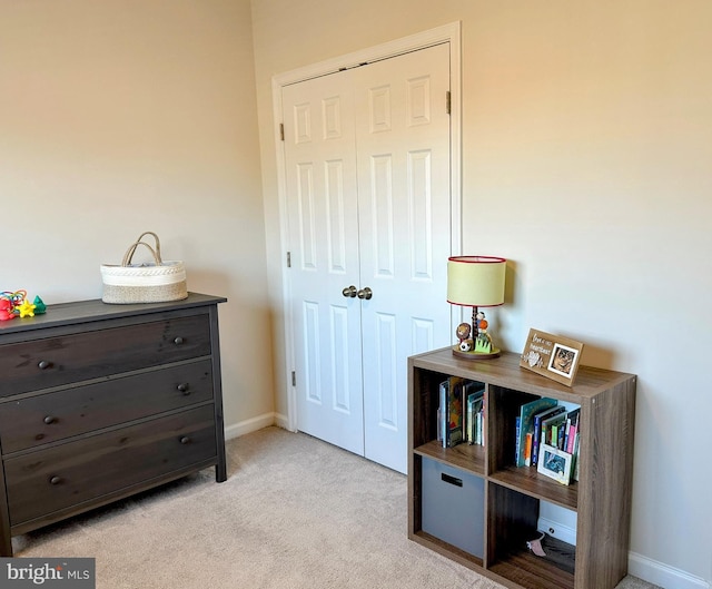 carpeted bedroom featuring a closet