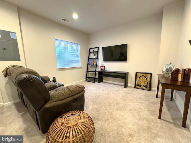 carpeted living room with electric panel