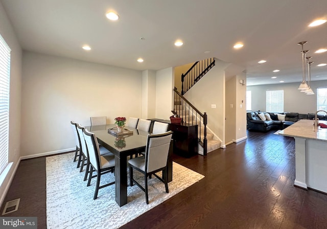 dining room featuring dark hardwood / wood-style flooring