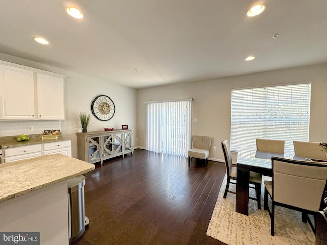 dining area featuring dark hardwood / wood-style floors