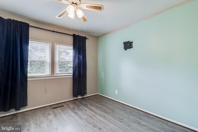 unfurnished room featuring ceiling fan and light hardwood / wood-style floors