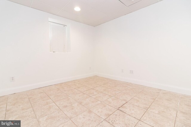 clothes washing area with sink, light tile patterned floors, and washing machine and dryer