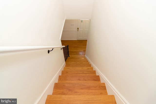 stairway featuring hardwood / wood-style flooring