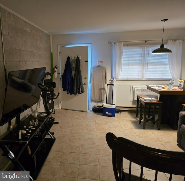 interior space featuring light tile patterned floors and a wall mounted AC