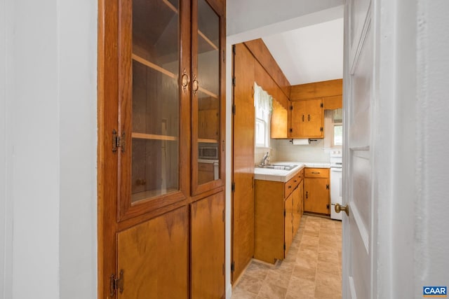 interior space with sink and white stove