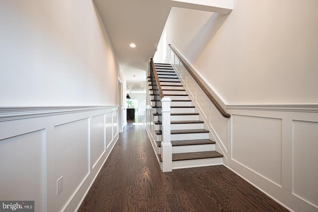 hallway with dark wood-type flooring