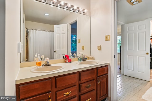 bathroom with vanity and tile patterned floors