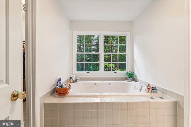 bathroom with tiled bath